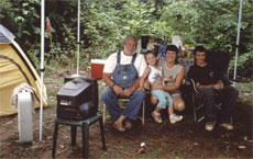Camping witha TV and a fan.